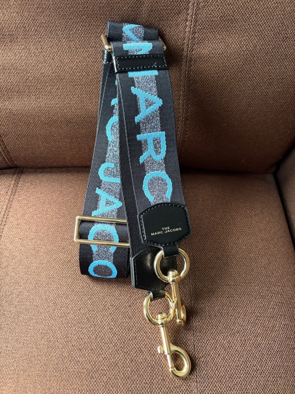 Marc Jacobs Black Strap with Turquoise Logo and Gold Hardware